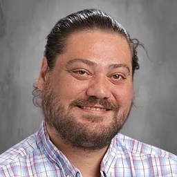 Portrait of Cameron Hall, high school counselor
